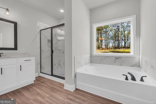 a bathroom with double vanity sink a mirror and vanity
