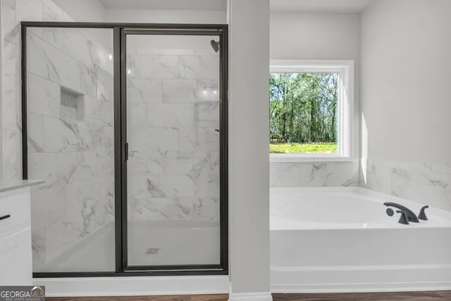 a white toilet sitting next to a shower