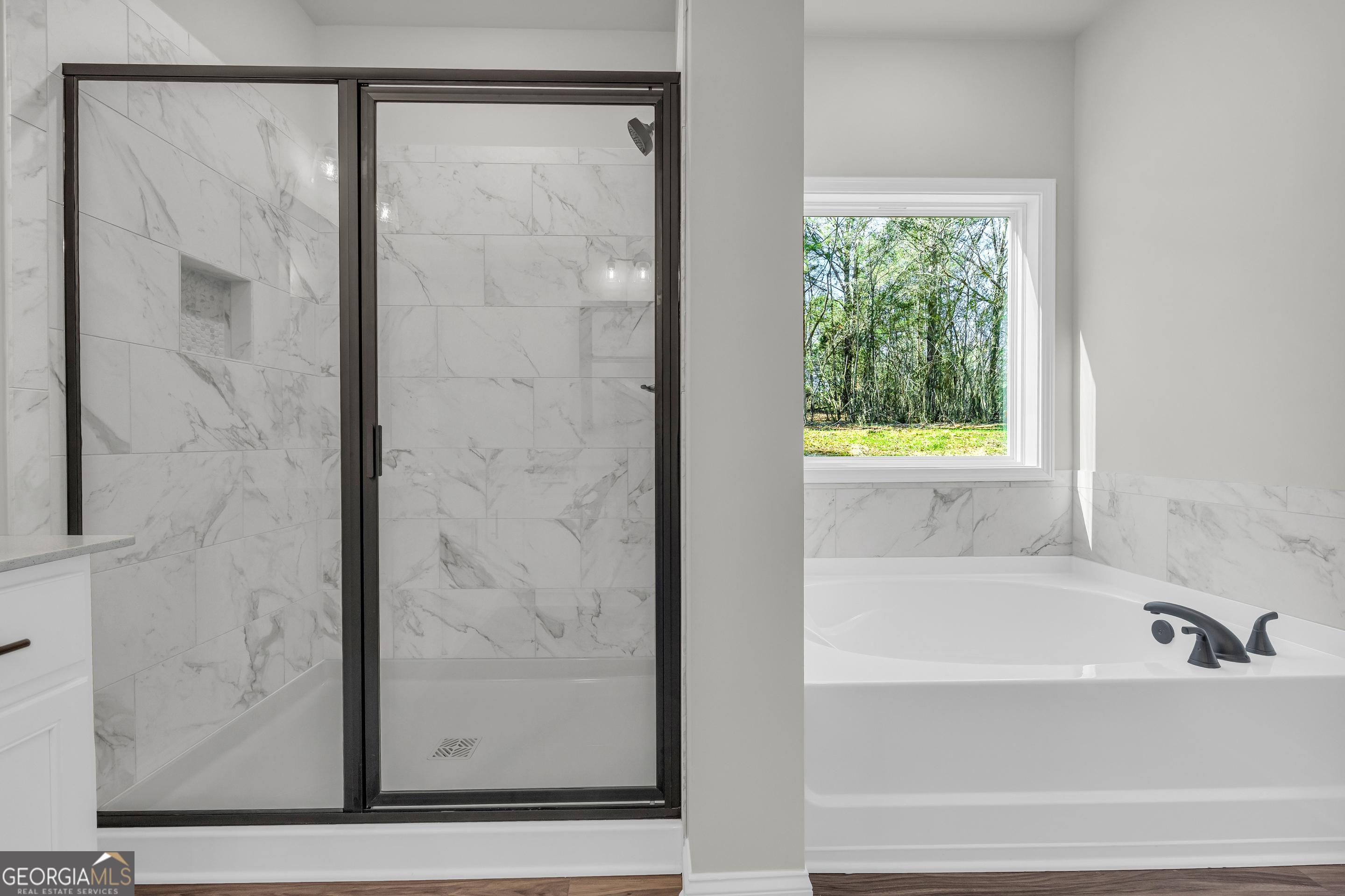 174 Old Milltown Road Hartwell, GA 30643 - Photo 36 of 53 a bathroom with a bathtub and a shower