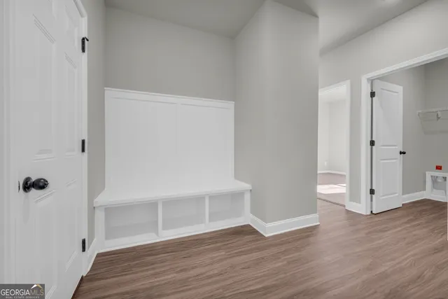 a view of a small space with racks on the wall