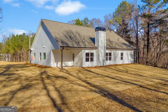 a view of a backyard of the house