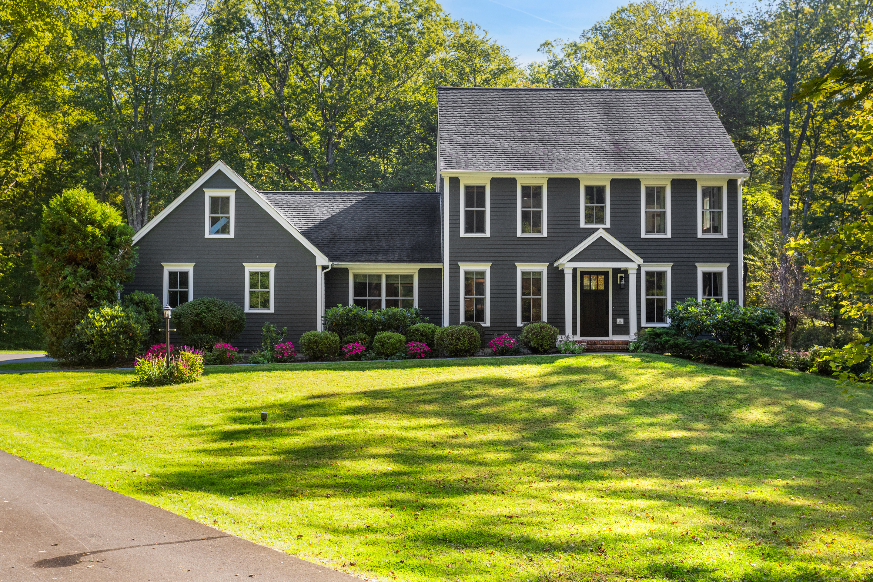 94 Old Stagecoach Road Redding, CT 06896 - Photo 1 of 1 a front view of a house with a yard