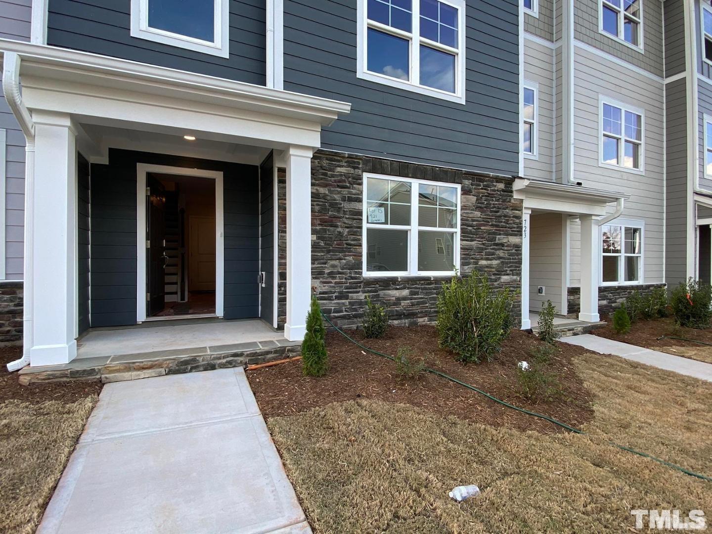 632 Gimari Drive Wake Forest, NC 27587 - Photo 1 of 18 a view of a brick building with many windows