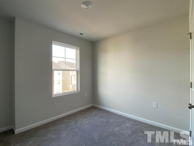 632 Gimari Drive Wake Forest, NC 27587 - Photo 12 of 18 an empty room with a window