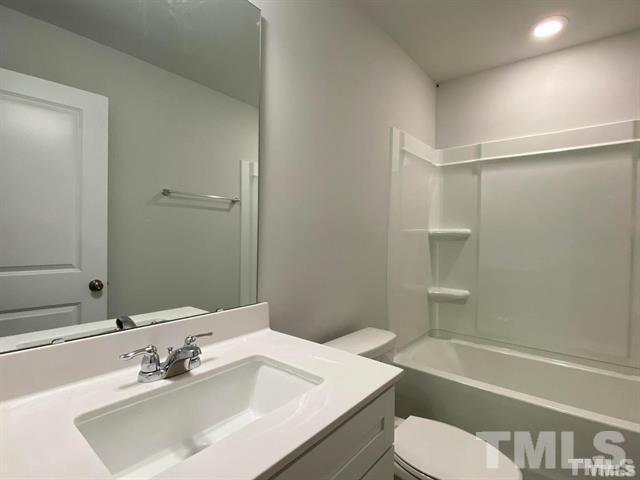632 Gimari Drive Wake Forest, NC 27587 - Photo 14 of 18 a bathroom with a sink a toilet and shower