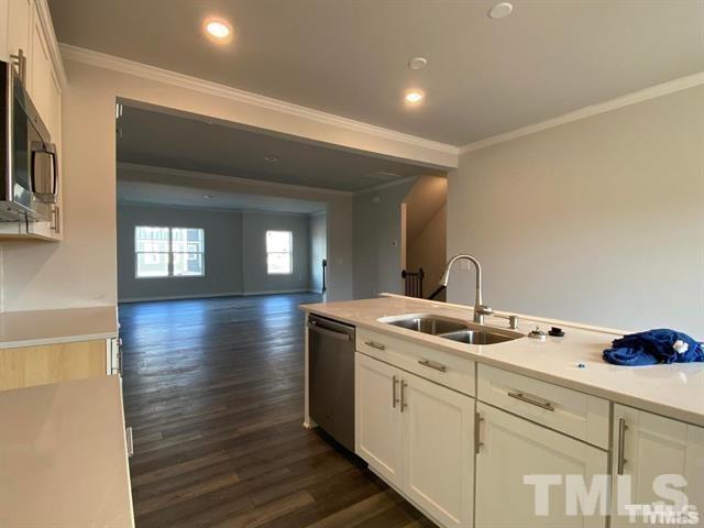 632 Gimari Drive Wake Forest, NC 27587 - Photo 3 of 18 a kitchen with sink and cabinets