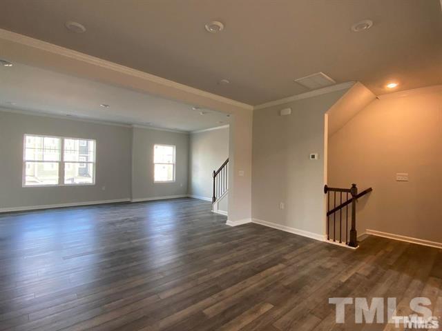632 Gimari Drive Wake Forest, NC 27587 - Photo 7 of 18 a view of empty room with wooden floor and fan