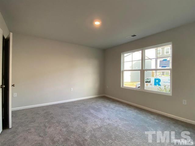 632 Gimari Drive Wake Forest, NC 27587 - Photo 8 of 18 an empty room with a window