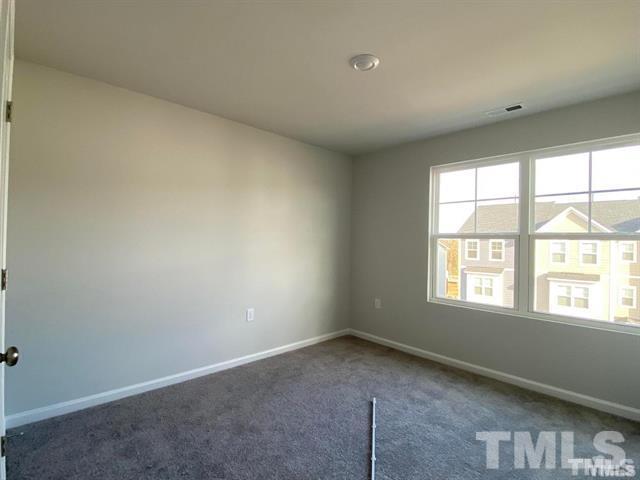 632 Gimari Drive Wake Forest, NC 27587 - Photo 10 of 18 an empty room with a window