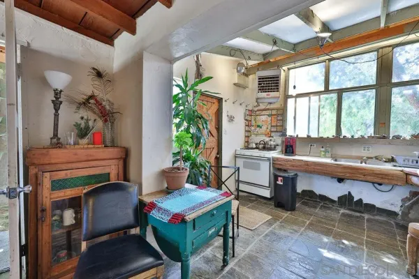 a room with furniture and a potted plant