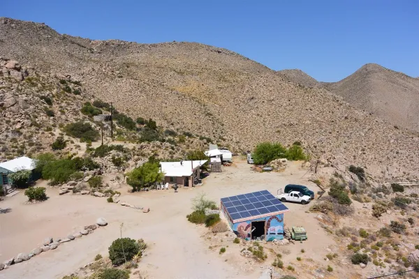 a group of cars parked in front of a house