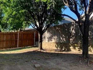 a view of a tree in front of a house
