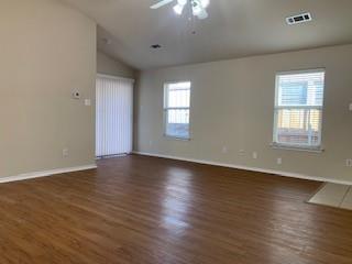 6421 Geneva Lane Fort Worth, TX 76131 - Photo 4 of 18 an empty room with wooden floor and windows