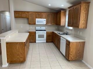 6421 Geneva Lane Fort Worth, TX 76131 - Photo 7 of 18 a kitchen with stainless steel appliances granite countertop a sink counter space cabinets and a sink