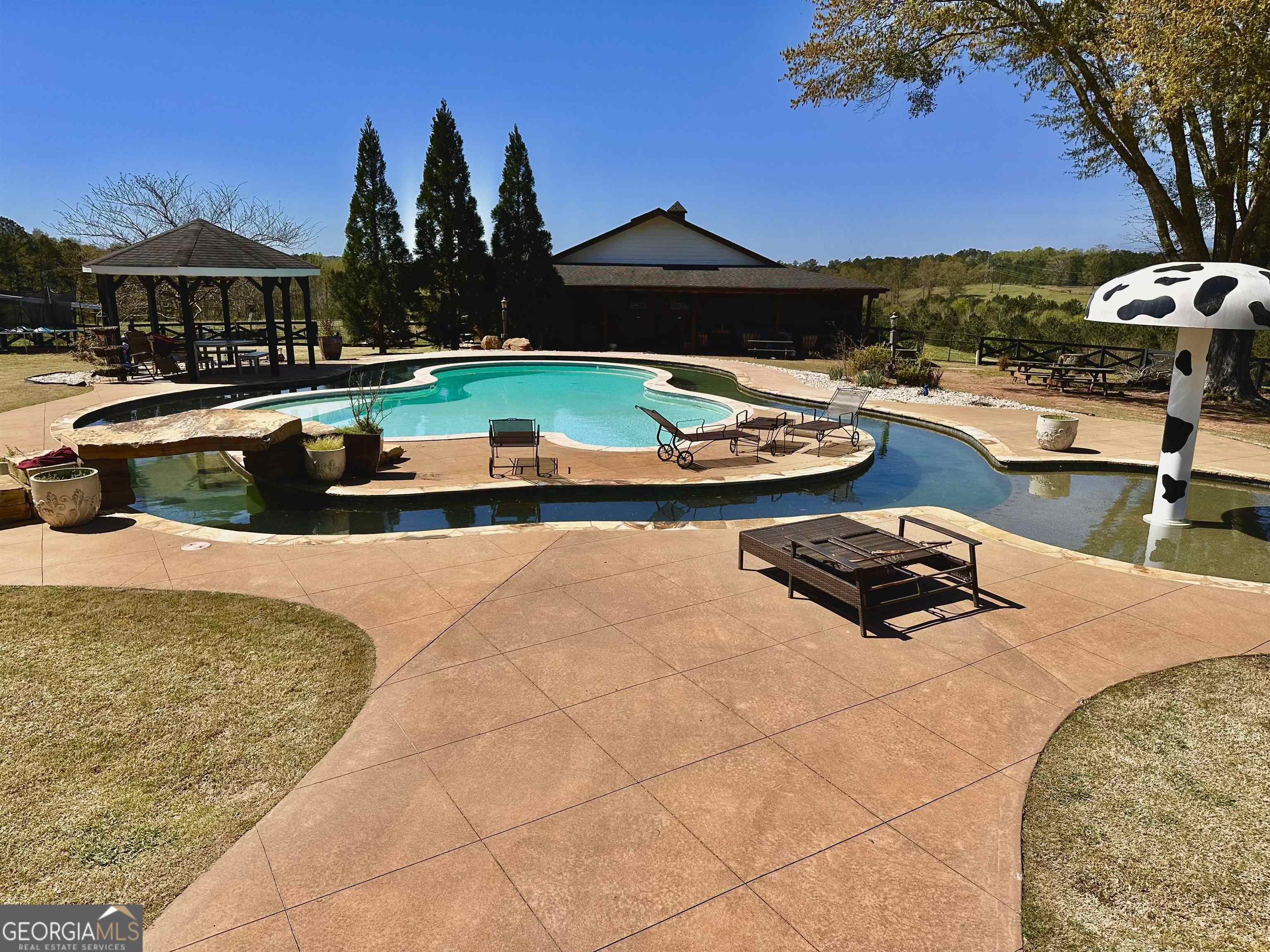 243 Ralls Road Hogansville, GA 30230 - Photo 24 of 39 a view of a swimming pool and lounge chairs