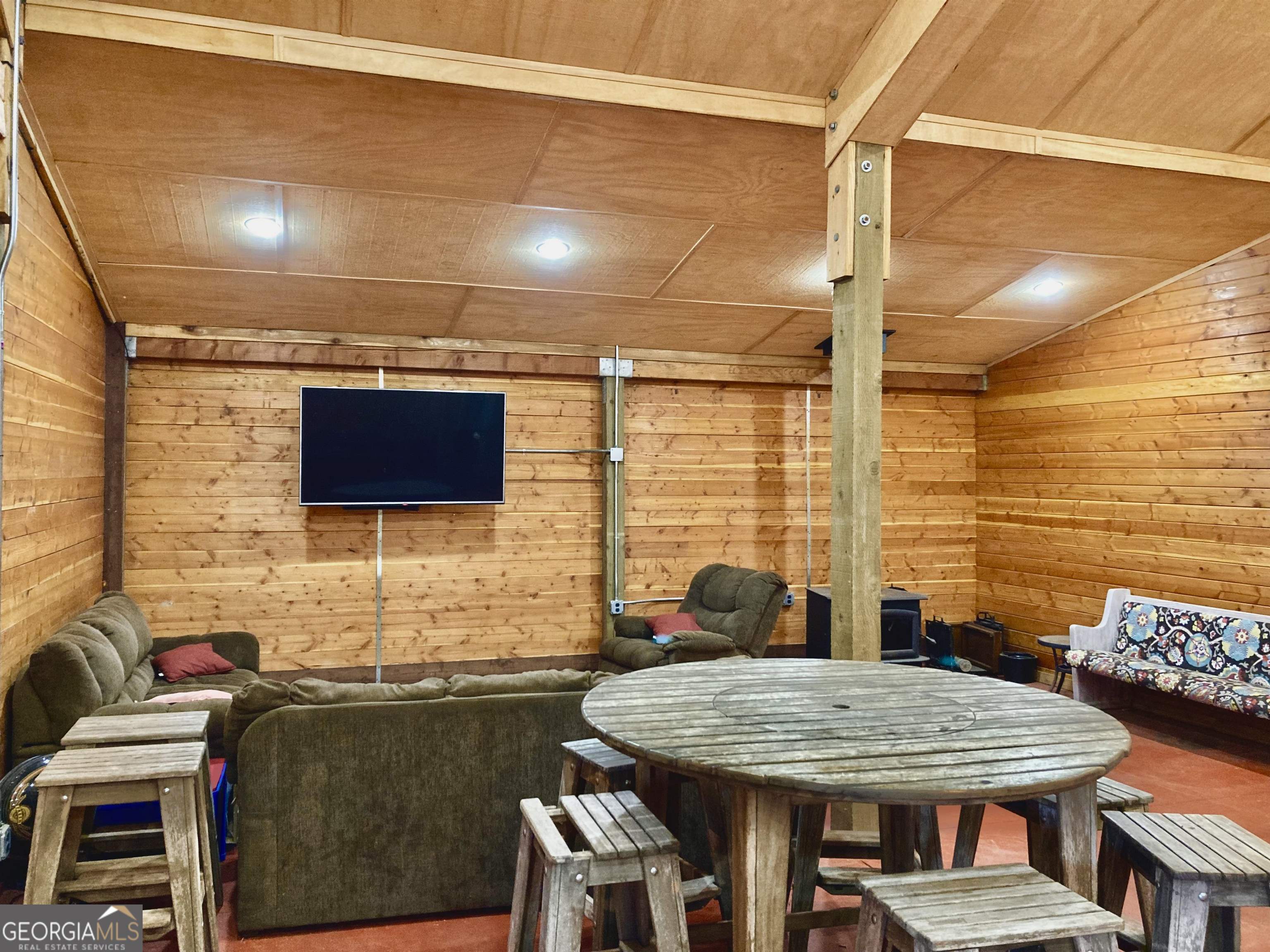 243 Ralls Road Hogansville, GA 30230 - Photo 29 of 39 a backyard of a house with table and chairs