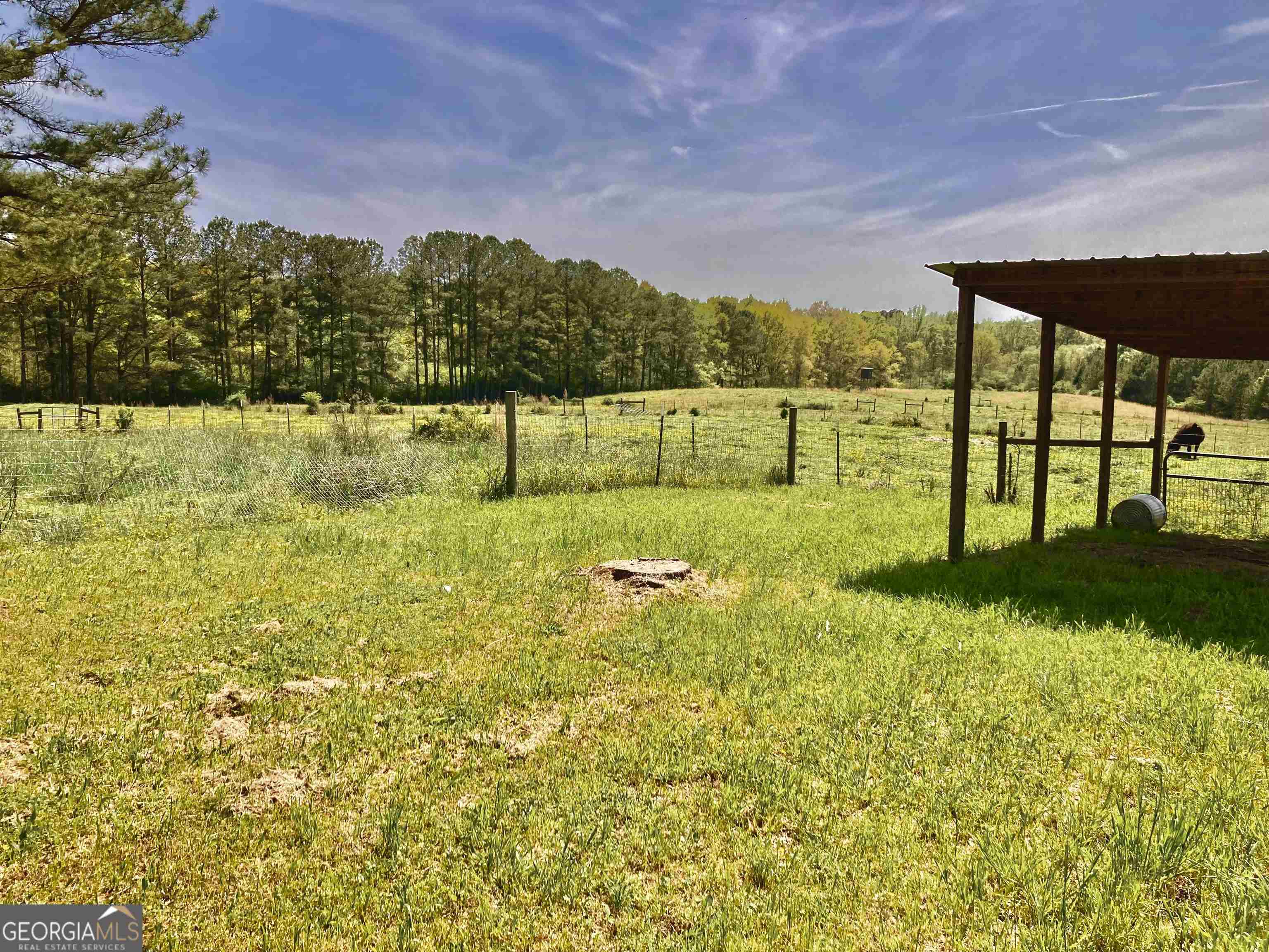 243 Ralls Road Hogansville, GA 30230 - Photo 33 of 39 a view of a garden with a building in the background
