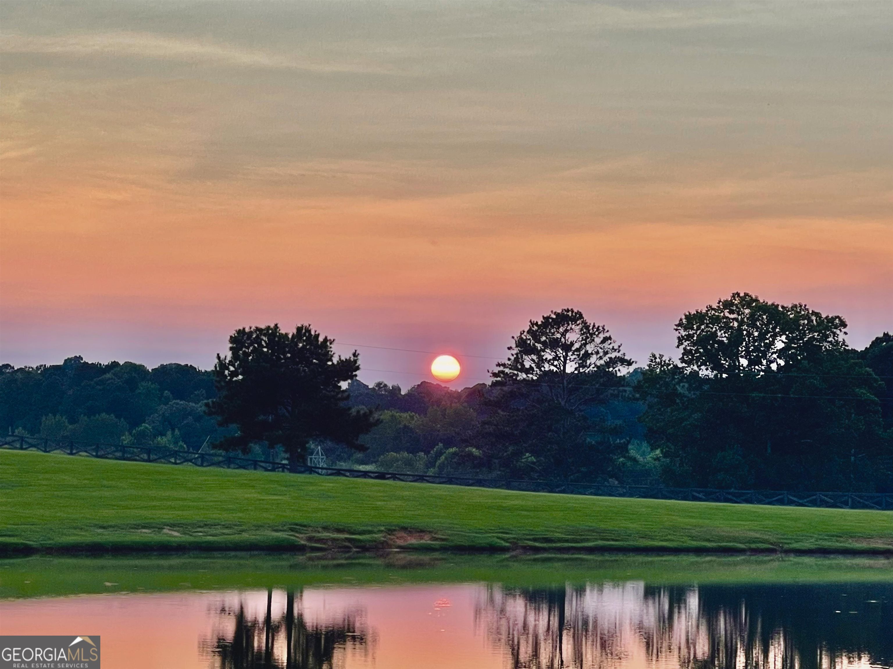 243 Ralls Road Hogansville, GA 30230 - Photo 38 of 39 a view of a golf course with a lake