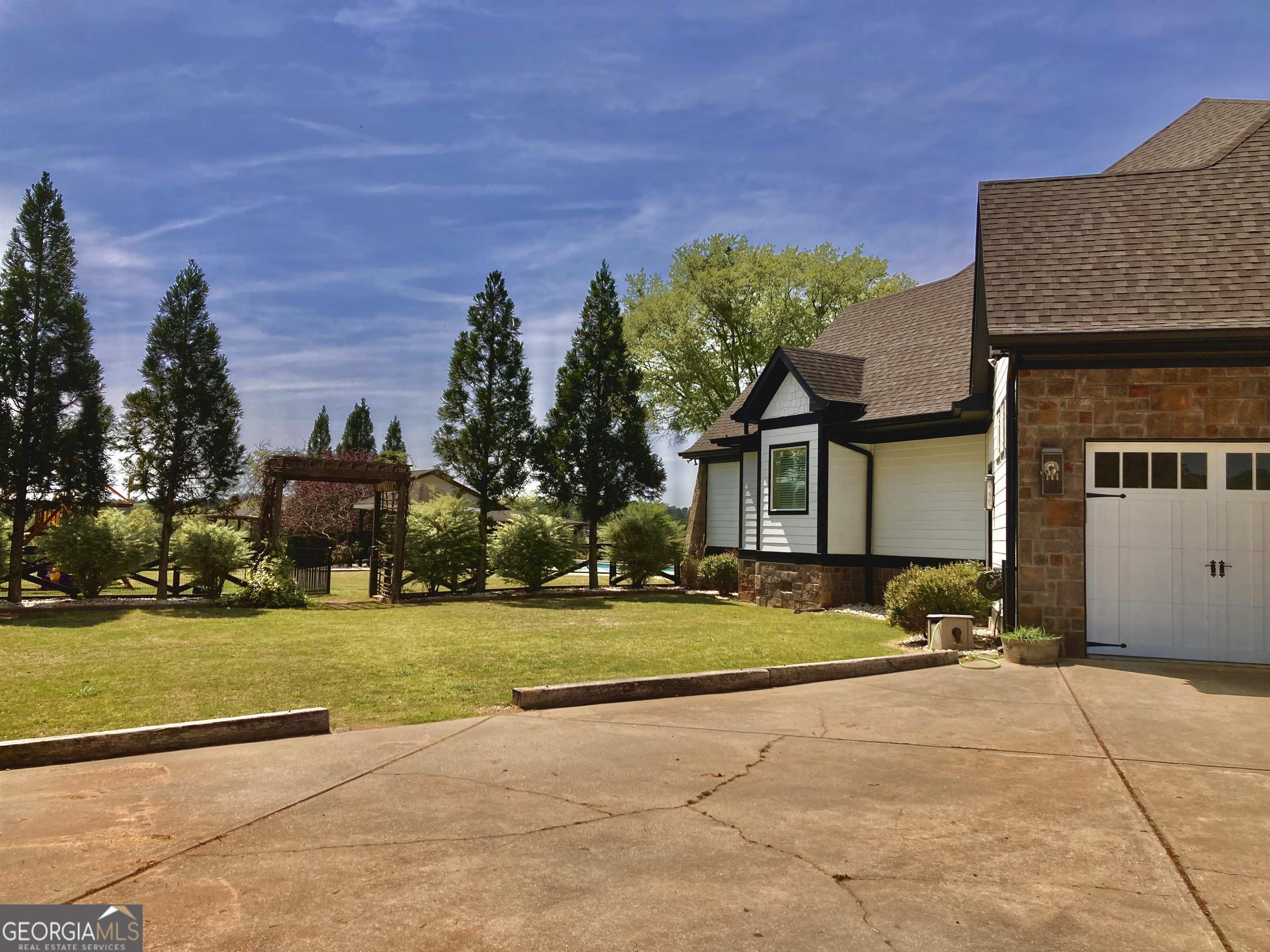 243 Ralls Road Hogansville, GA 30230 - Photo 4 of 39 a front view of a house with a yard and trees