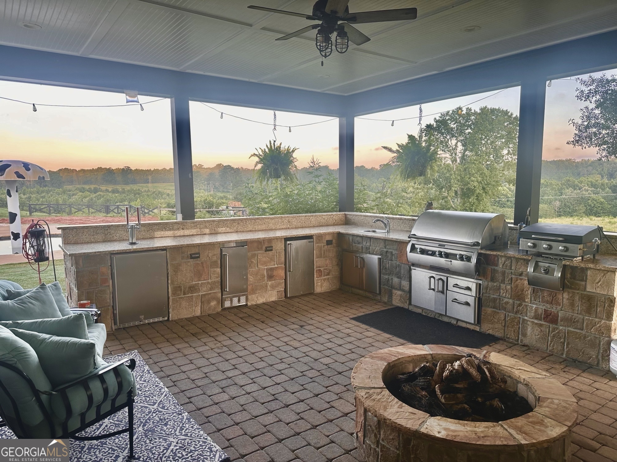 243 Ralls Road Hogansville, GA 30230 - Photo 6 of 39 a kitchen with stainless steel appliances granite countertop a stove a sink and a dining table