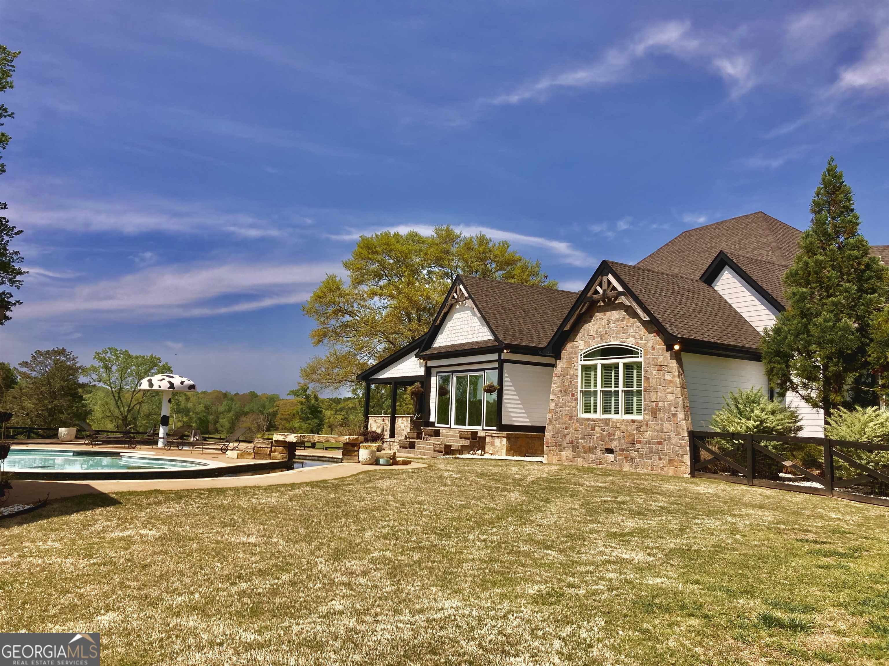 243 Ralls Road Hogansville, GA 30230 - Photo 7 of 39 a front view of a house with swimming pool