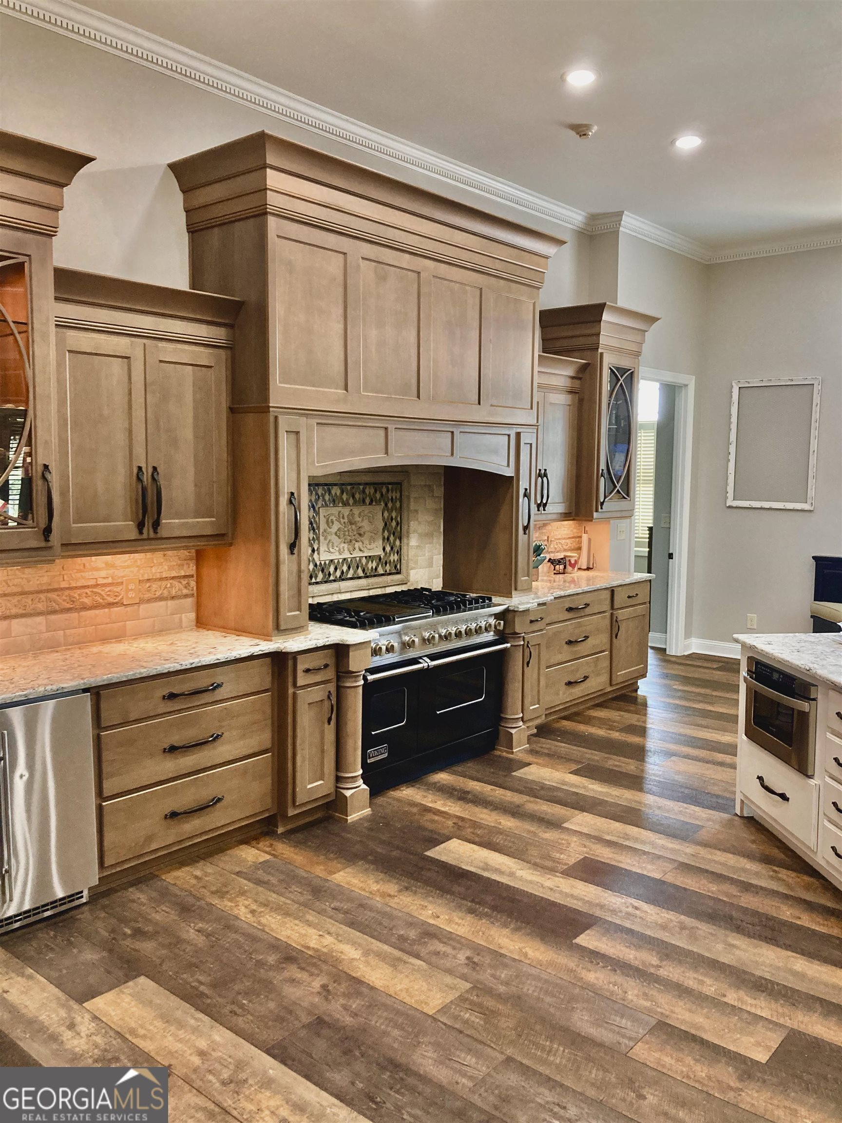 243 Ralls Road Hogansville, GA 30230 - Photo 10 of 39 a kitchen with stainless steel appliances kitchen island granite countertop a stove and a sink