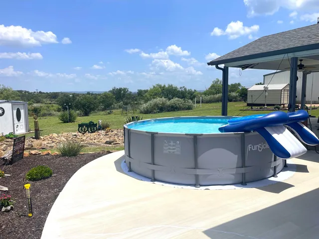 a kitchen with stainless steel appliances granite countertop a stove a sink dishwasher and a refrigerator