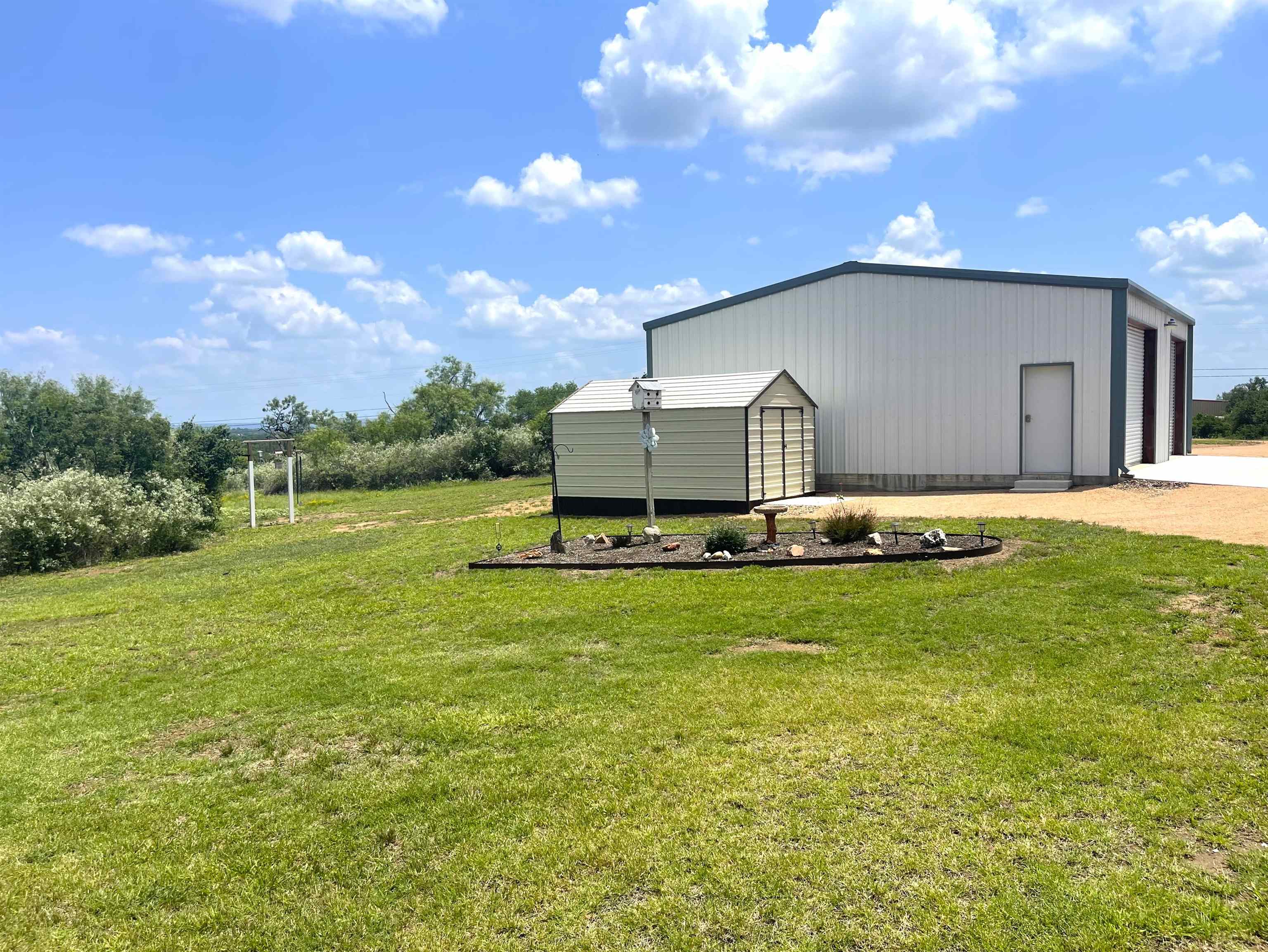 202 Rio Llano Drive West Llano, TX 78643 - Photo 24 of 29 a view of a back yard of the house with a yard