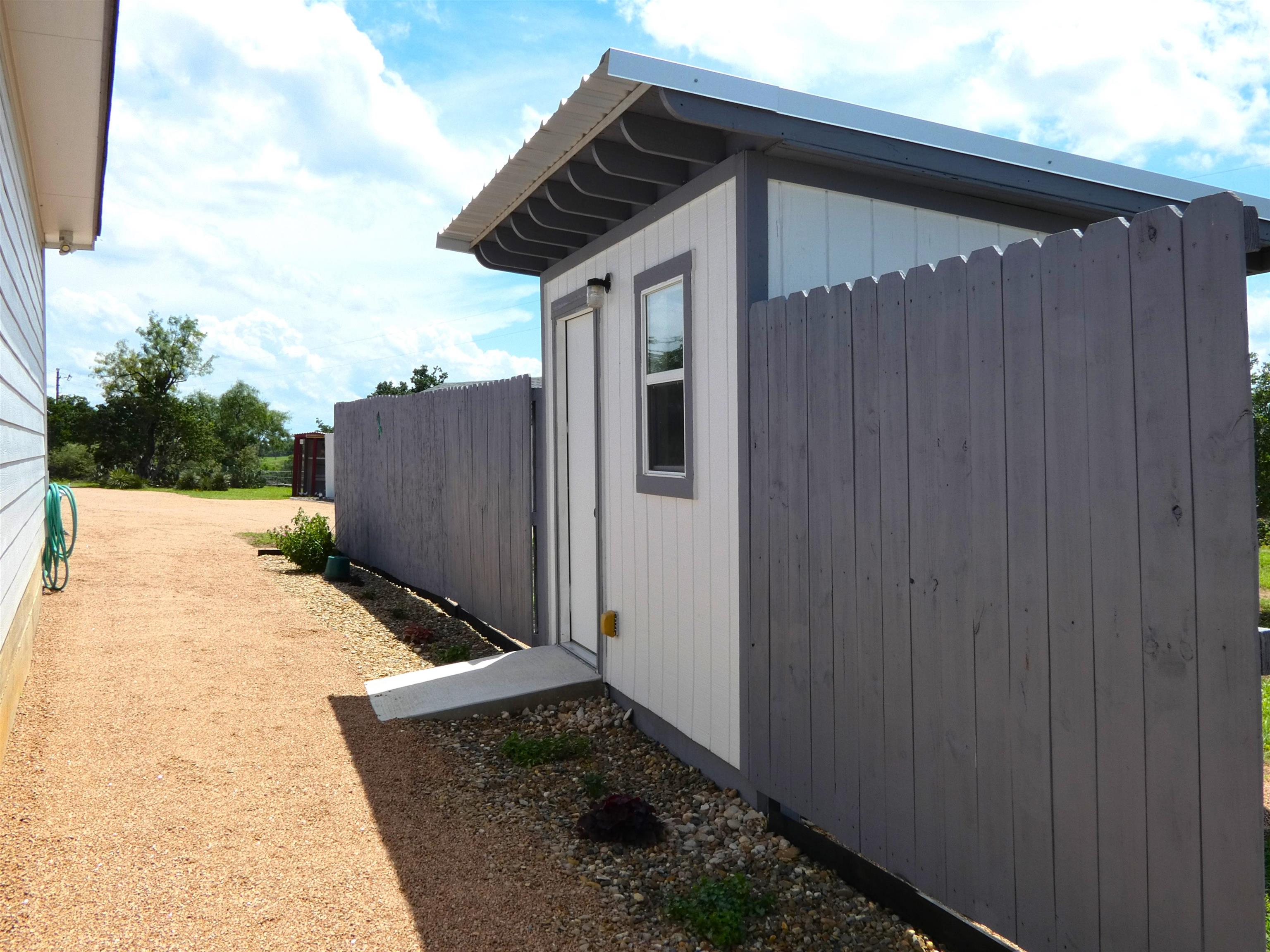 202 Rio Llano Drive West Llano, TX 78643 - Photo 26 of 29 a backyard of a house