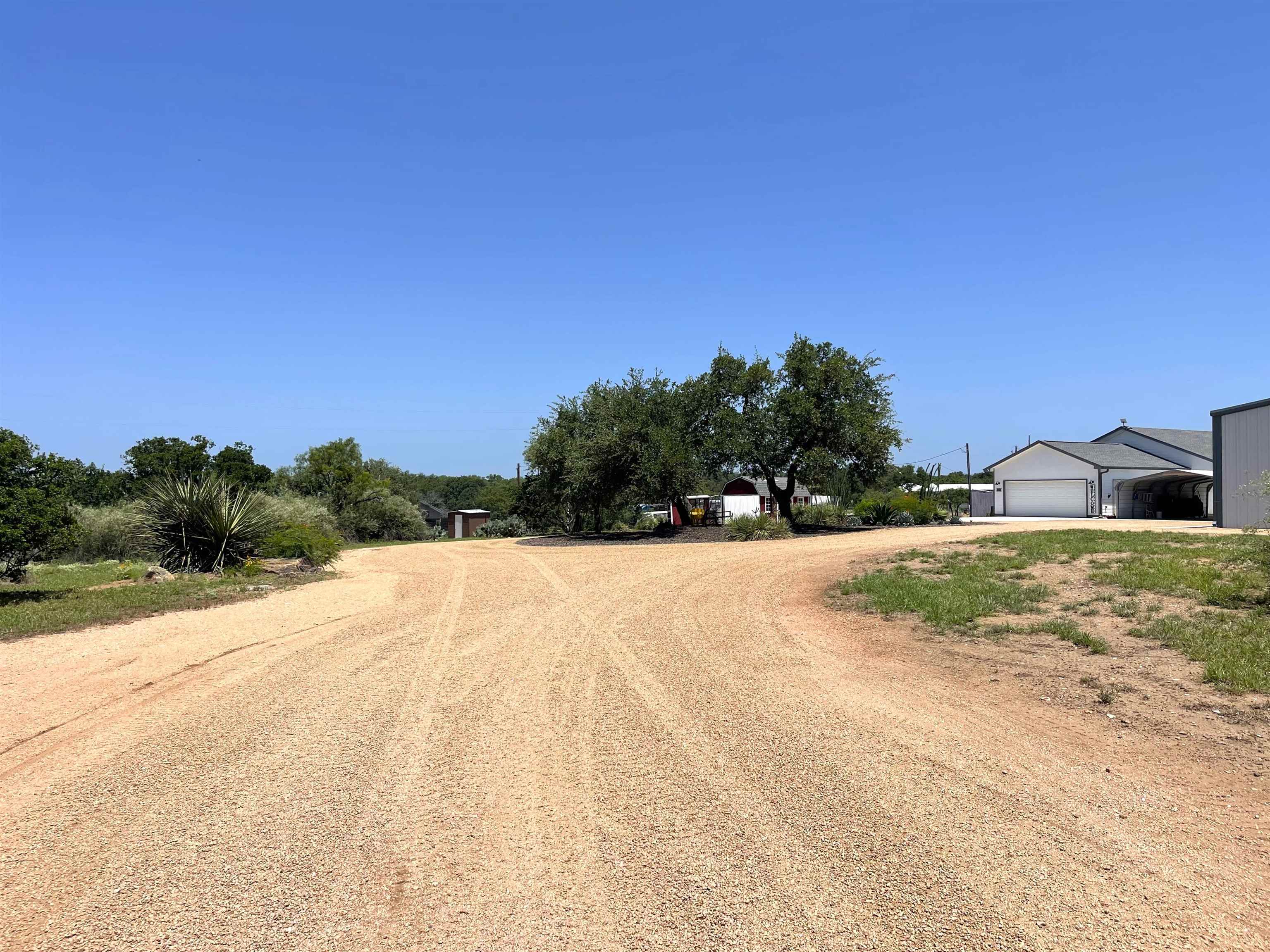 202 Rio Llano Drive West Llano, TX 78643 - Photo 3 of 29 a view of outdoor space and yard