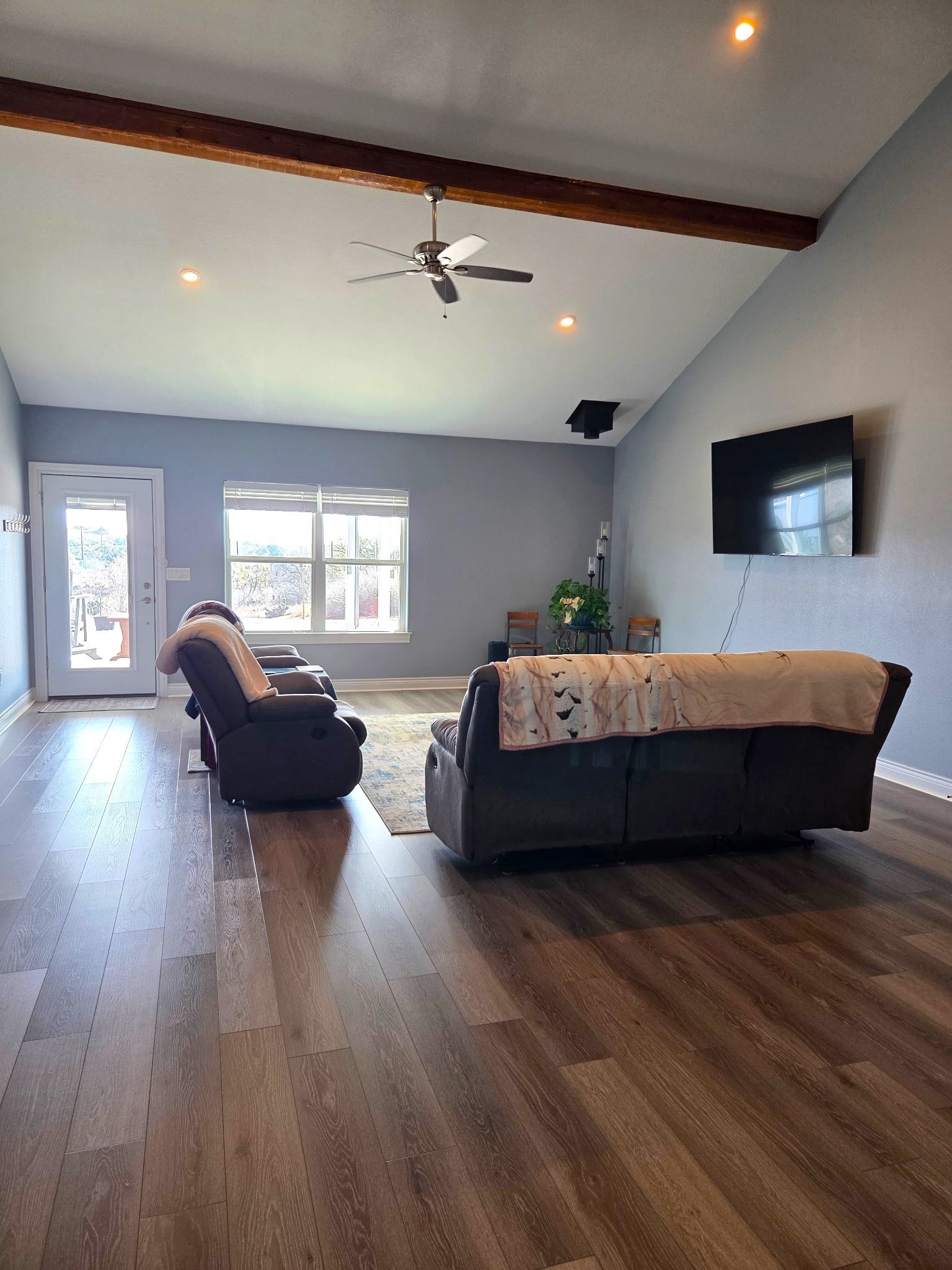 202 Rio Llano Drive West Llano, TX 78643 - Photo 6 of 29 a living room with a bed furniture and a flat screen tv