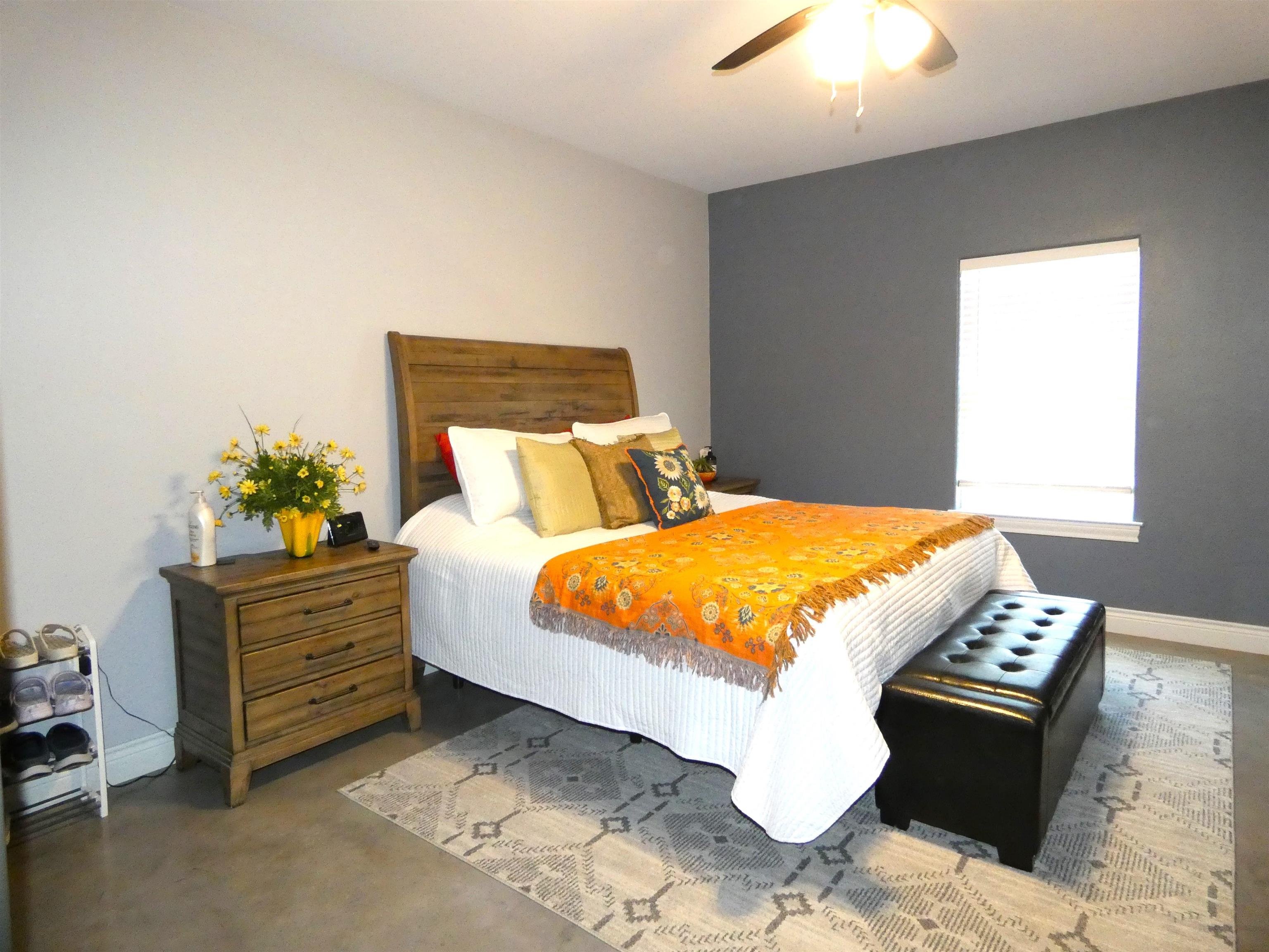 202 Rio Llano Drive West Llano, TX 78643 - Photo 10 of 29 a bed sitting in a bedroom next to a window