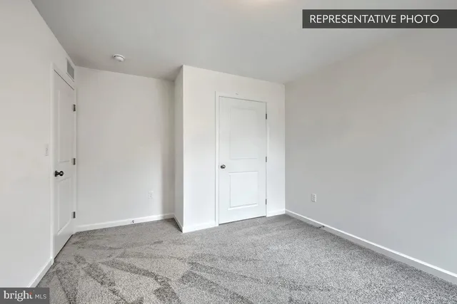 a spacious bathroom with a double vanity sink and a mirror