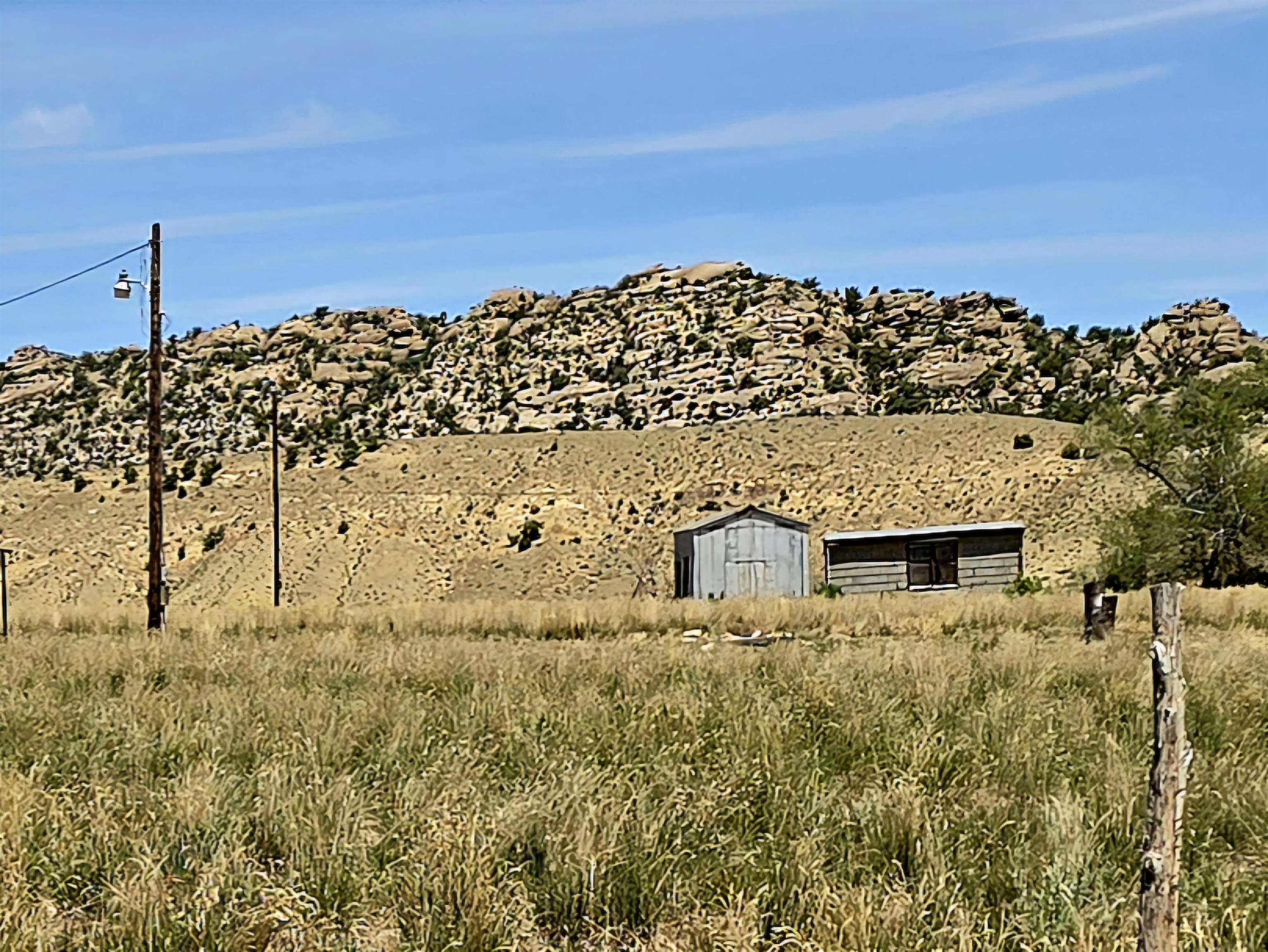 300 4th Street Dinosaur, CO 81610 - Photo 2 of 13 a large building with trees in the background