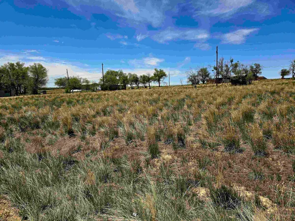 a view of a building with mountains in the background