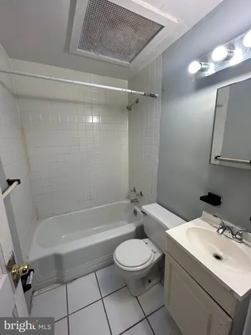 a bathroom with a sink a toilet and a bathtub