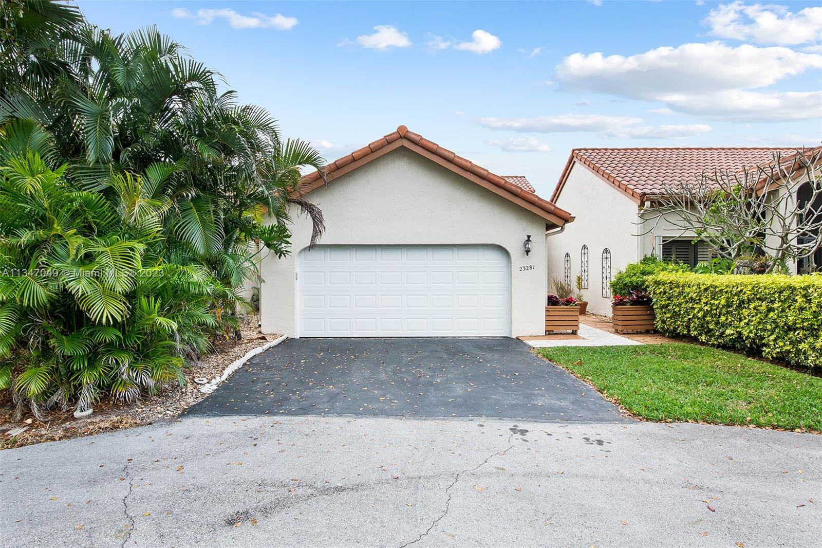 23281 Water Circle Boca Raton, FL 33486 - Photo 1 of 2 a view of a house with a yard plants and large tree