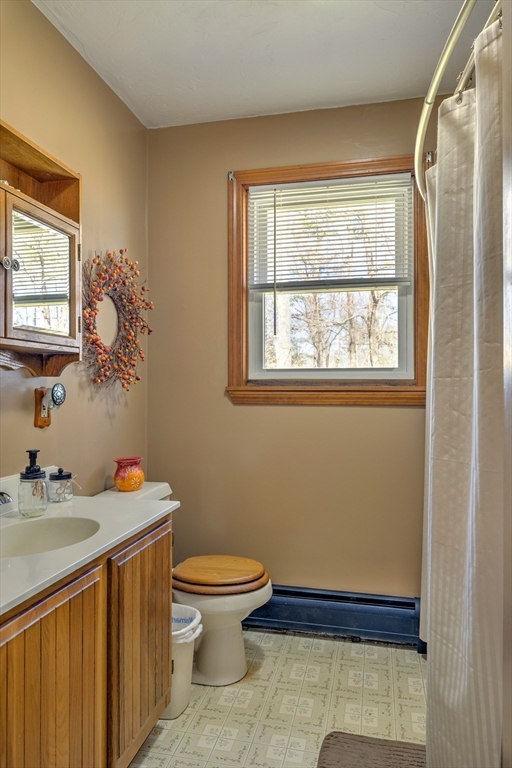 84 Long Hill Road Brookfield, MA 01506 - Photo 15 of 42 a bathroom with a toilet sink and mirror