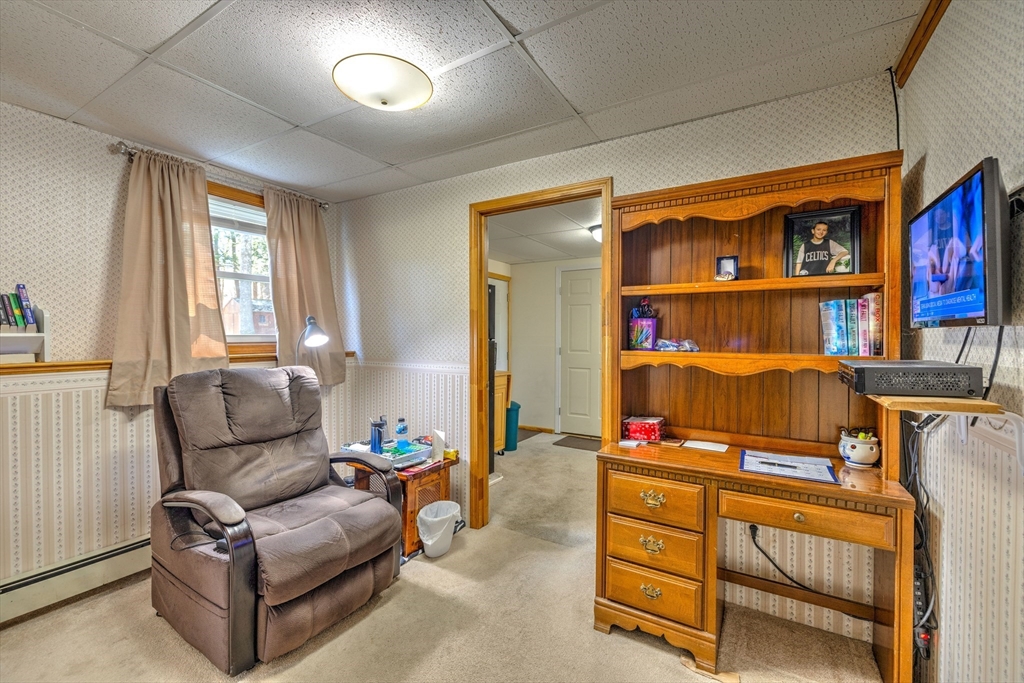 84 Long Hill Road Brookfield, MA 01506 - Photo 19 of 42 a living room with furniture cabinets and a window