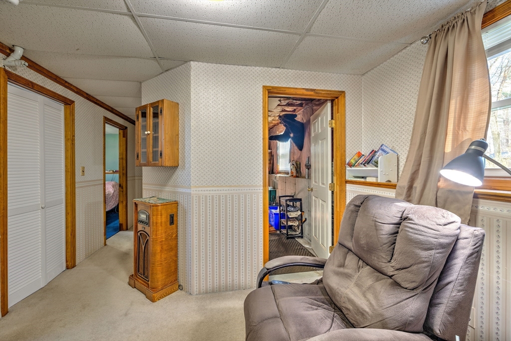 84 Long Hill Road Brookfield, MA 01506 - Photo 20 of 42 a living room with furniture and a window