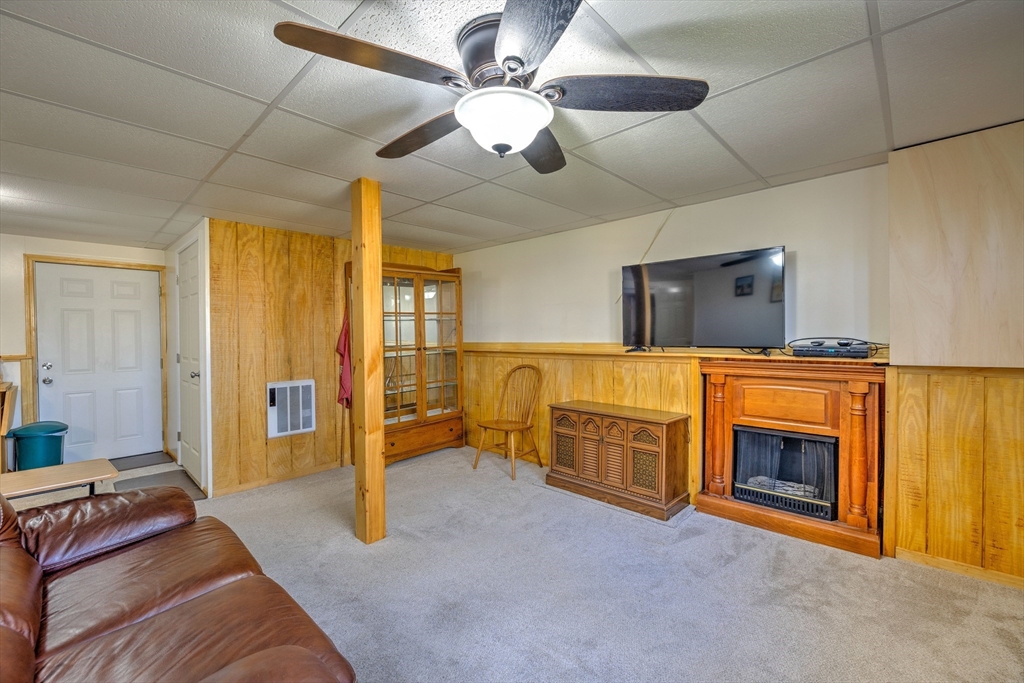 84 Long Hill Road Brookfield, MA 01506 - Photo 24 of 42 a living room with furniture and a fireplace