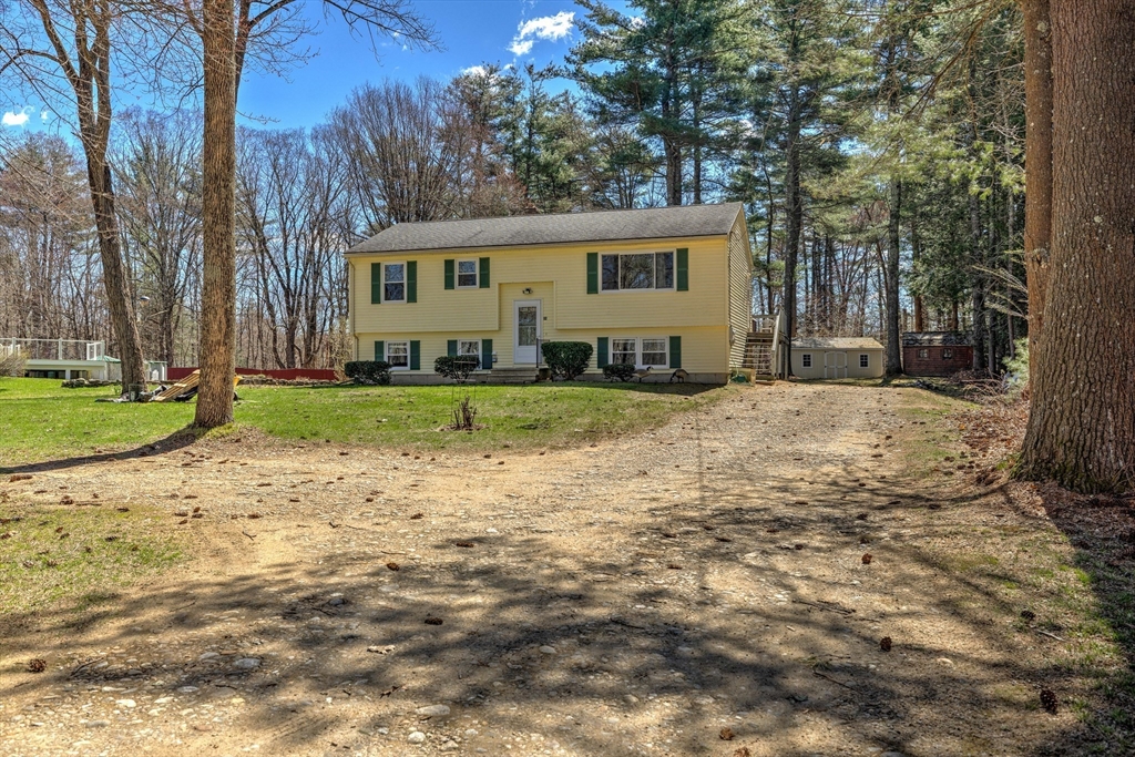 84 Long Hill Road Brookfield, MA 01506 - Photo 34 of 42 a view of a house with a yard and large tree