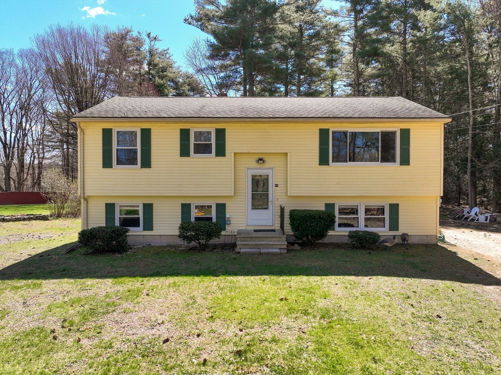 84 Long Hill Road Brookfield, MA 01506 - Photo 35 of 42 a view front of house with yard and trees in the background