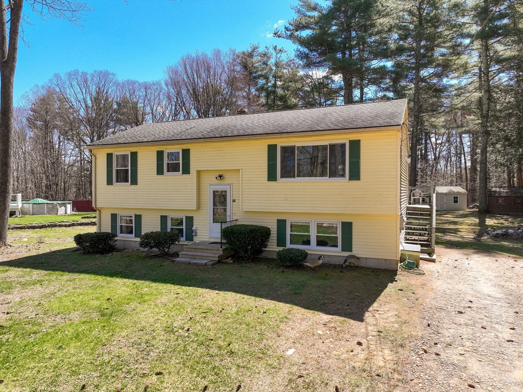 84 Long Hill Road Brookfield, MA 01506 - Photo 36 of 42 a view of a house with backyard and sitting area