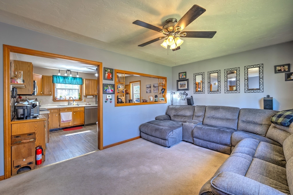 84 Long Hill Road Brookfield, MA 01506 - Photo 9 of 42 a living room with furniture and kitchen view