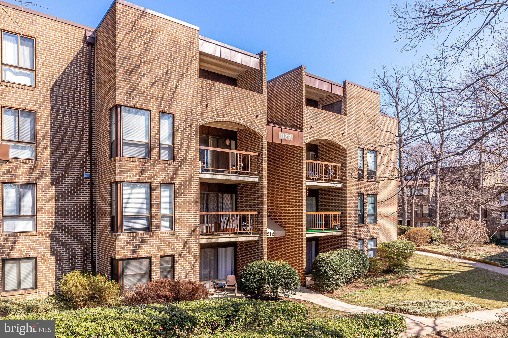 11212 Chestnut Grove Square, Unit 216 Reston, VA 20190 - Photo 2 of 31 All Brick Garden-Style Condo