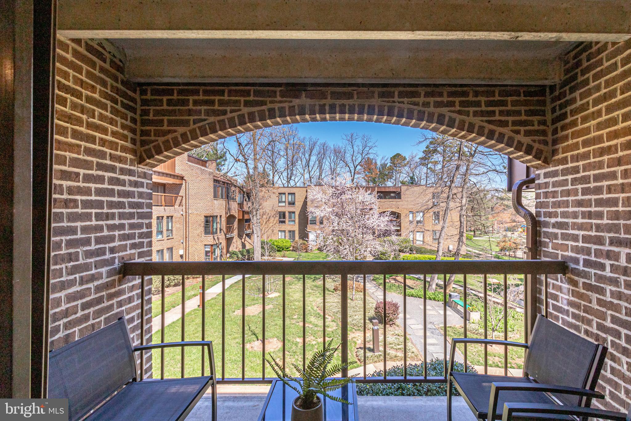 11212 Chestnut Grove Square, Unit 216 Reston, VA 20190 - Photo 20 of 31 Covered Balcony Overlooking Courtyard