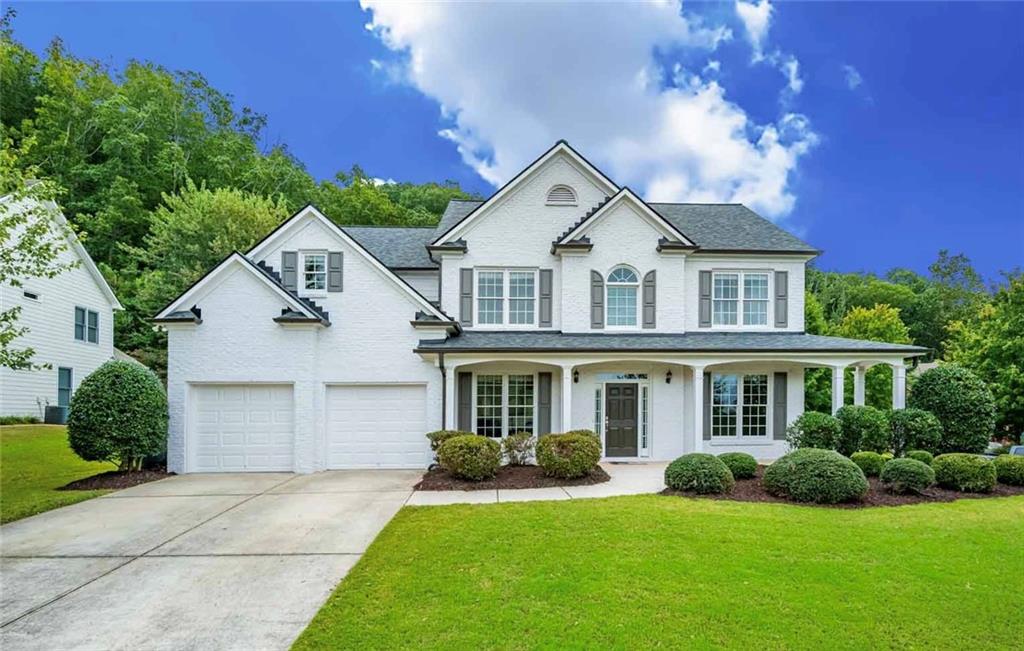 7110 High Ridge Court Cumming, GA 30041 - Photo 1 of 1 front view of a house with a yard