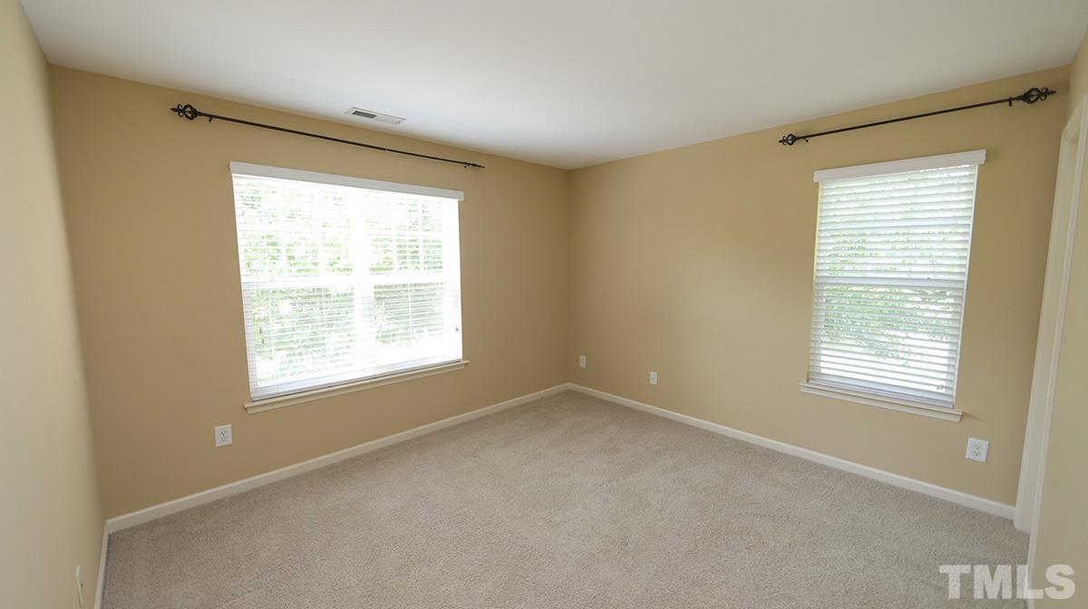 301 Dimock Way Wake Forest, NC 27587 - Photo 11 of 14 Two additional upstairs bedrooms are connected by a shared bath with a large soaking tub/shower