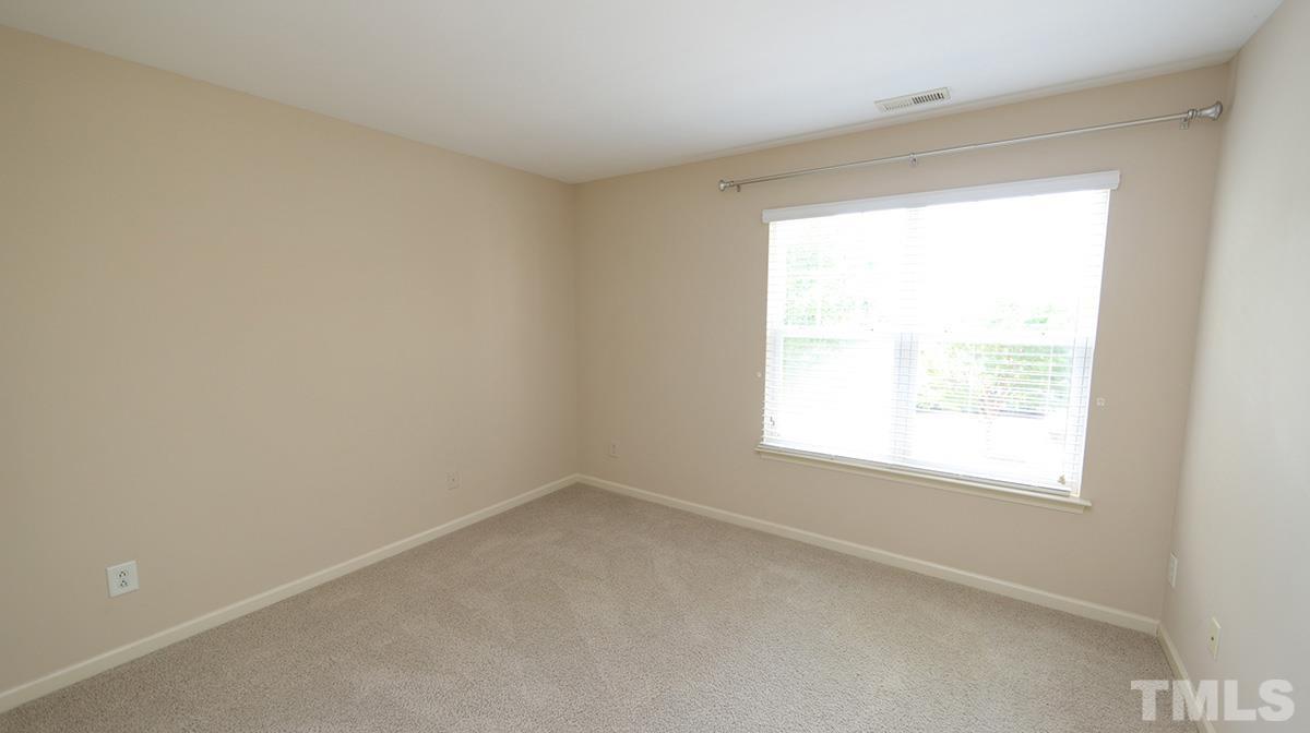 301 Dimock Way Wake Forest, NC 27587 - Photo 12 of 14 Two additional upstairs bedrooms are connected by a shared bath with a large soaking tub/shower